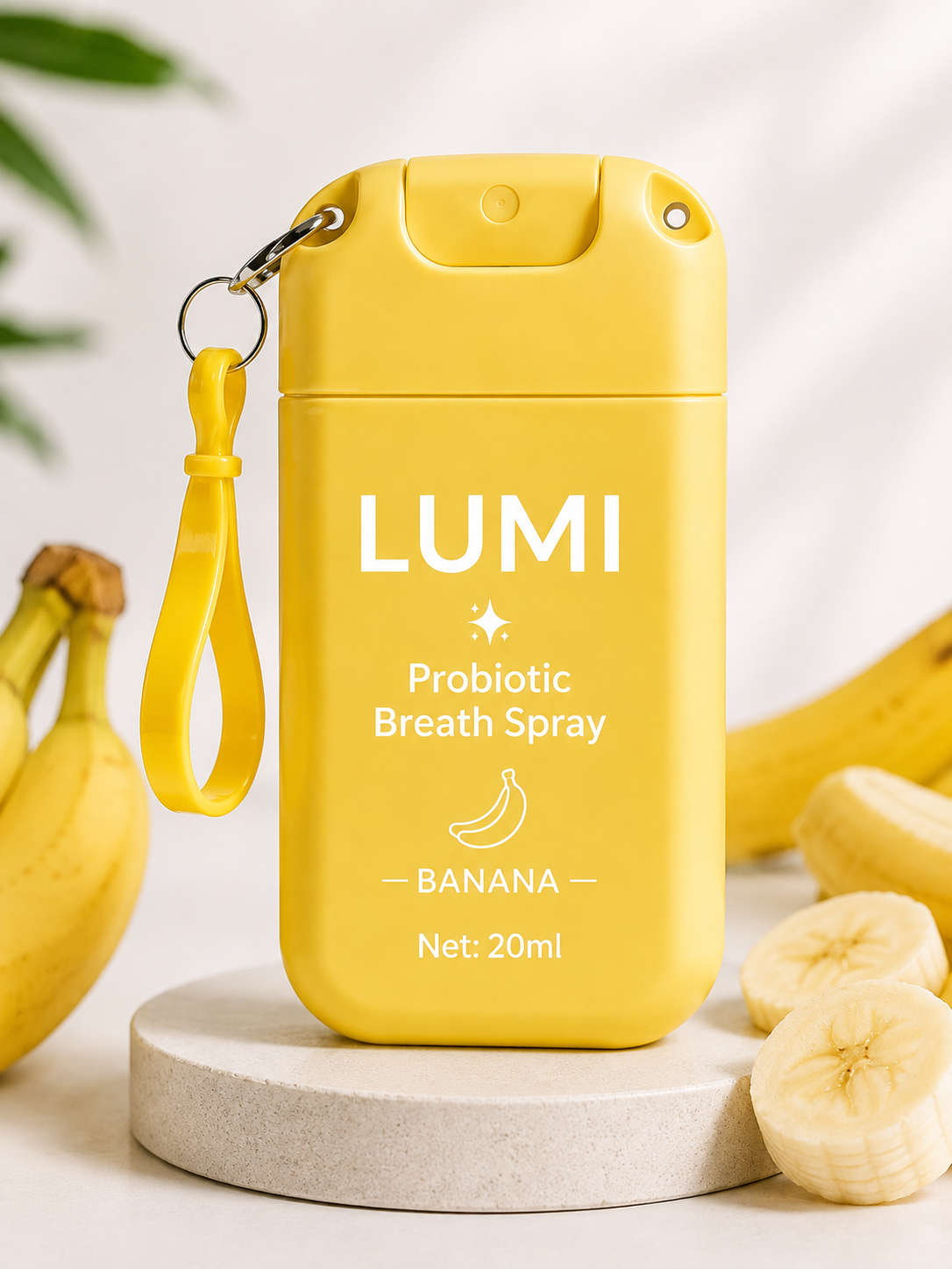 LUMI Banana probiotic breath spray, 20 ml pocket bottle with keychain clip.